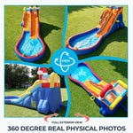 Commercial inflatable slide for outdoor use, rainbow theme, with climbing wall, ball pit, ring toss and basketball