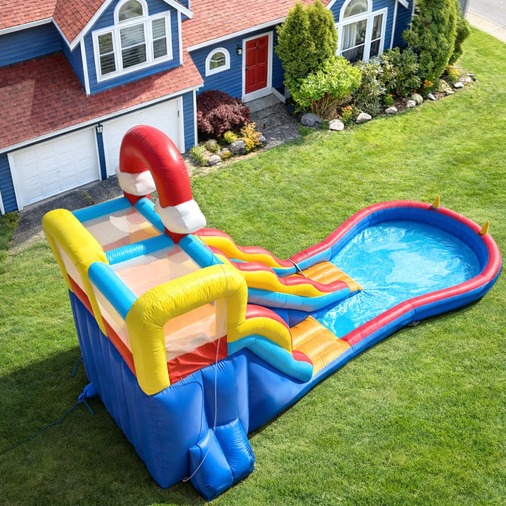 Commercial inflatable slide for outdoor use, rainbow theme, with climbing wall, ball pit, ring toss and basketball